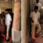 அமைச்சர் ரமேஷ் ஸ்ரீரங்கம் கோயில் கோபுரத்தை பார்வையிடும் காட்சி