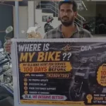 திருப்பூரில் ஓலா ஷோரூம் முன் கேக் வெட்டி போராட்டம் நடத்திய இளைஞர் சந்தோஷ்