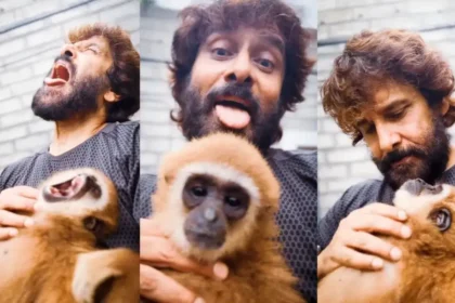நடிகர் விக்ரம் குட்டிக் குரங்குடன் விளையாடும் காட்சி