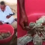 கறையான் அரித்த ரூபாய் நோட்டுகளை கையில் வைத்திருக்கும் விவசாயி