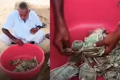 கறையான் அரித்த ரூபாய் நோட்டுகளை கையில் வைத்திருக்கும் விவசாயி