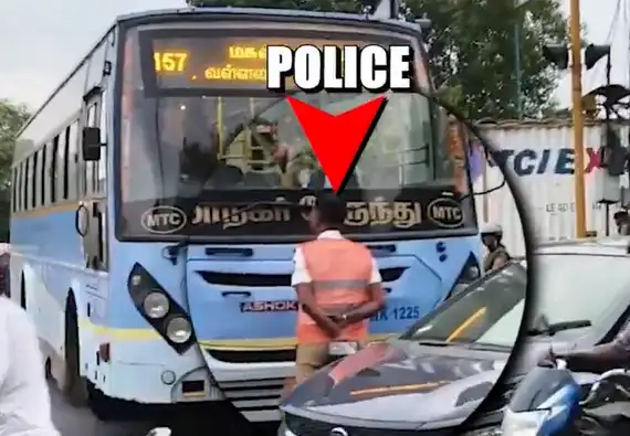போக்குவரத்து காவலர் அரசு பேருந்தை தடுத்து நிறுத்துதல்